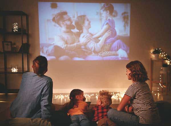 home entertainment system family watching tv in living room